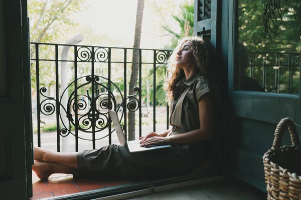 Pensive Young Female Casual Clothes Sitting Laptop Computer Floor Cozy Royalty Free Stock Photos