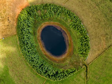 Aerial view of beautiful lagoon in the Azores islands. Drone landscape view with lines and textures in the background. Top view of volcanic crater, tourist attraction of Portugal. clipart