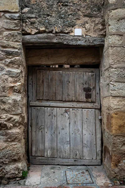 Old small door in the historical village of Pedraza. Segovia Spain.