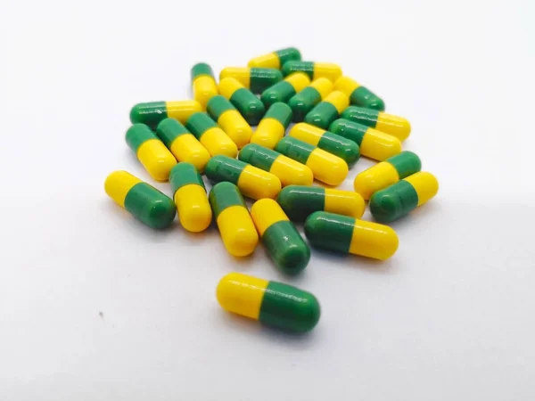 Medication Concept Many Yellow Green Capsules Tramadol Isolated White Background — Stock Photo, Image