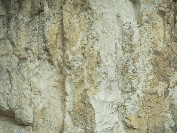 Texture of a chalk mountain close-up. Cracks, breaks, and water drips — Stock Photo, Image