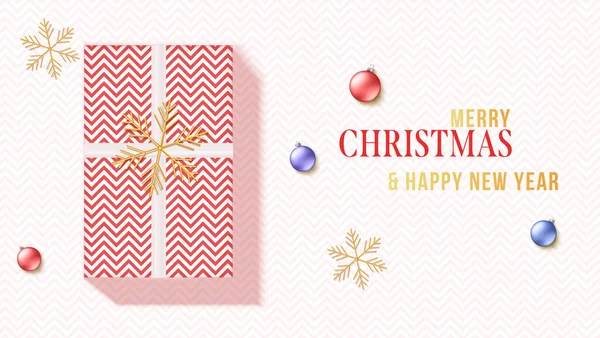 Gegroet kaart met geschenkdoos, gouden sneeuwvlokken en kerstballen. Kerstkaart met zigzagpatroon. Vector 3d illustratie. — Stockvector