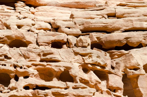 Texture of orange stone rock in a colored canyon close up — Stock Photo, Image