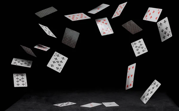 Playing cards fall on a black table — Stock Photo, Image