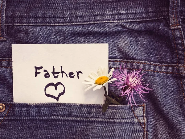 Wildflowers and paper note with the word FATHER — Stock Photo, Image