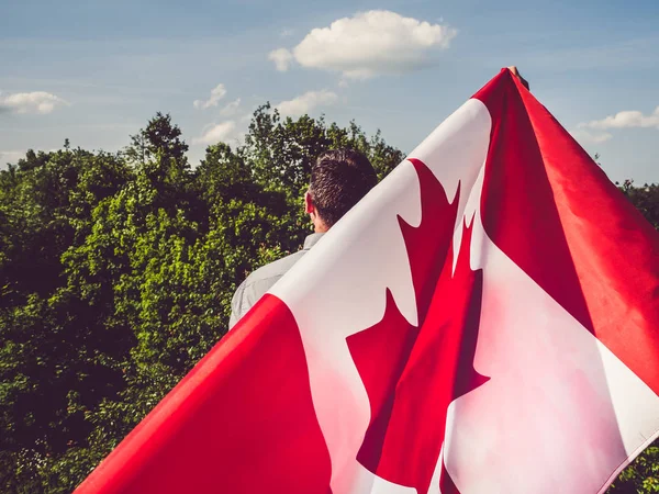 Man waving a Canadian Flag. National holiday — Stock Photo, Image