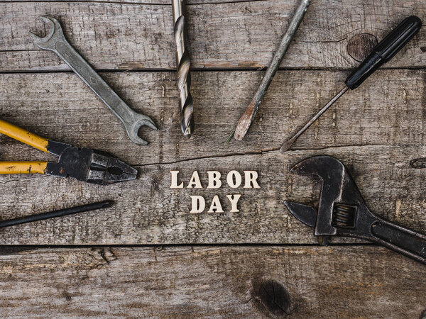 LABOR DAY. Hand tools and wooden letters