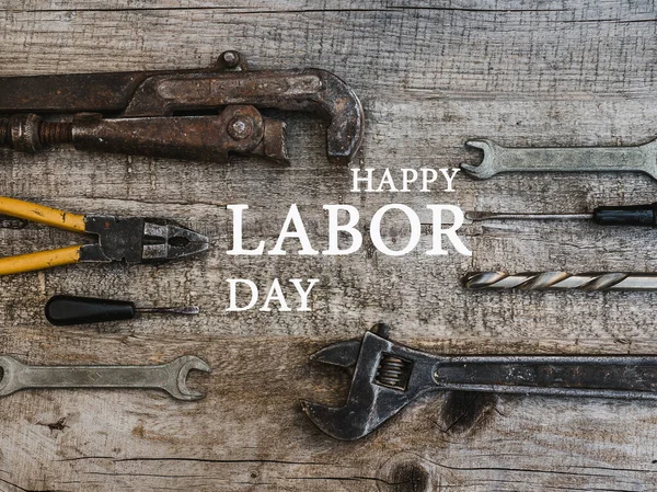 LABOR DAY. Hand tools lying on the table. Top view, close-up. Preparing for the celebration. Congratulations to loved ones, family, relatives, friends and colleagues National holiday concept