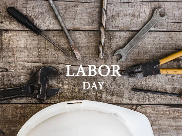 LABOR DAY. Hand tools lying on the table. Top view, close-up. Preparing for the celebration. Congratulations to loved ones, family, relatives, friends and colleagues National holiday concept