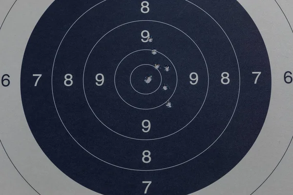 Bullet holes in the black target