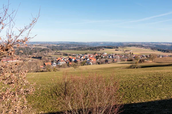 Little village in the middle of the german countryside with fore — Stock Photo, Image