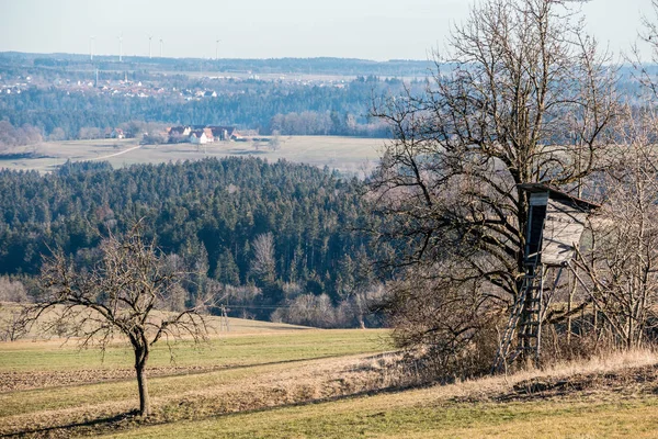 Raised hide on the field with the forest around — Stock Photo, Image