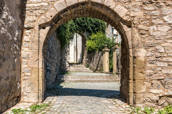 A gate made of stones near the church