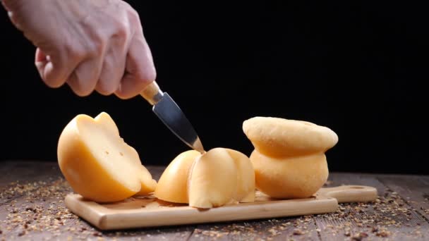 Set Delicious Cheese Put Wooden Board Black Background Female Hand — Stok video