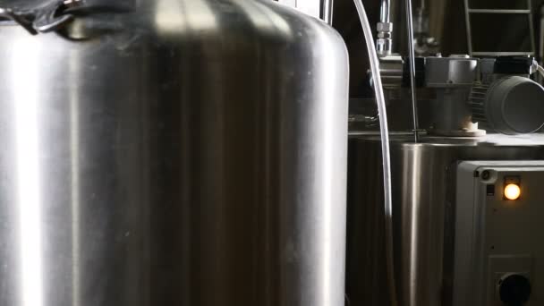 Modern brewery factory. Row of tanks in brewery. Fermentation in a brewery tanks with beer for brewing. Beer factory. Big steel tanks for storage. 4k — Stock Video