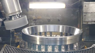 Equipment at bearing factory. machine tooling unit ready for polishing workpiece surface. Heavy industry concept. Close up. Shot in 4k