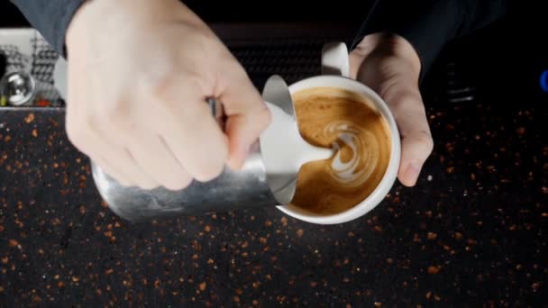 Coffee making video. Barista pouring hot milk in white cup making cappuccino. Close up. Bartender preparing morning coffee. Slow motion. hd — Stock Video