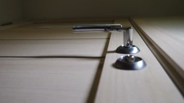 Low angle view. Male hands opening wooden door turning key to unlock office door. Open Door Handle. 4 k footage
