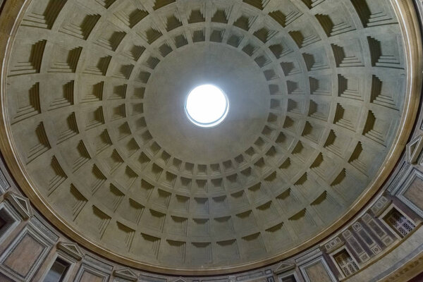 Hole in the roof of pantheon rome Italy from where sun is peeking through