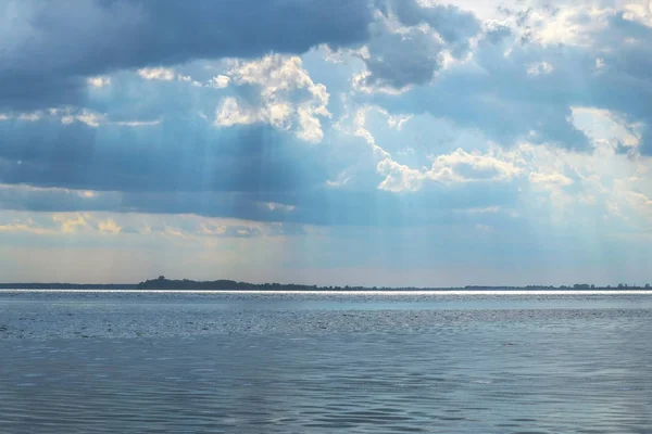 Clouds on the lake at the beginning of the rain. Natural phenomenon. Lake Svityaz in Ukraine.