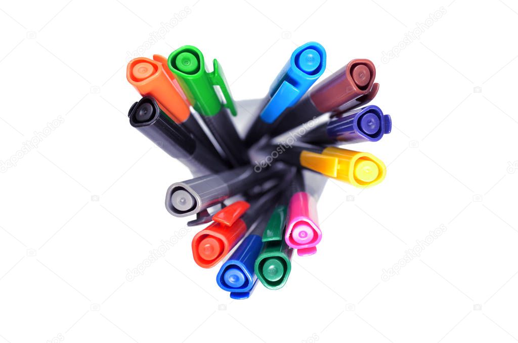 Set of multi-colored pens standing in a transparent glass, top view on white background, isolated, horysontally oriented