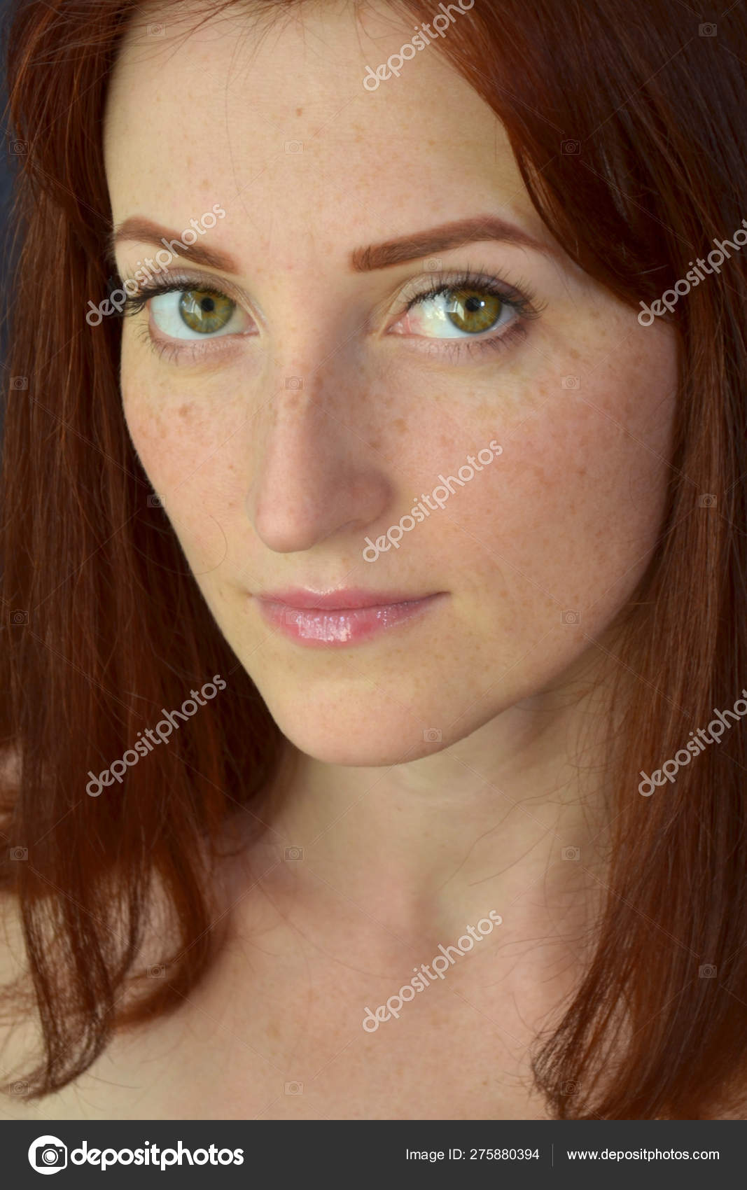 White Girl With Red Hair And Green Eyes With Freckles With