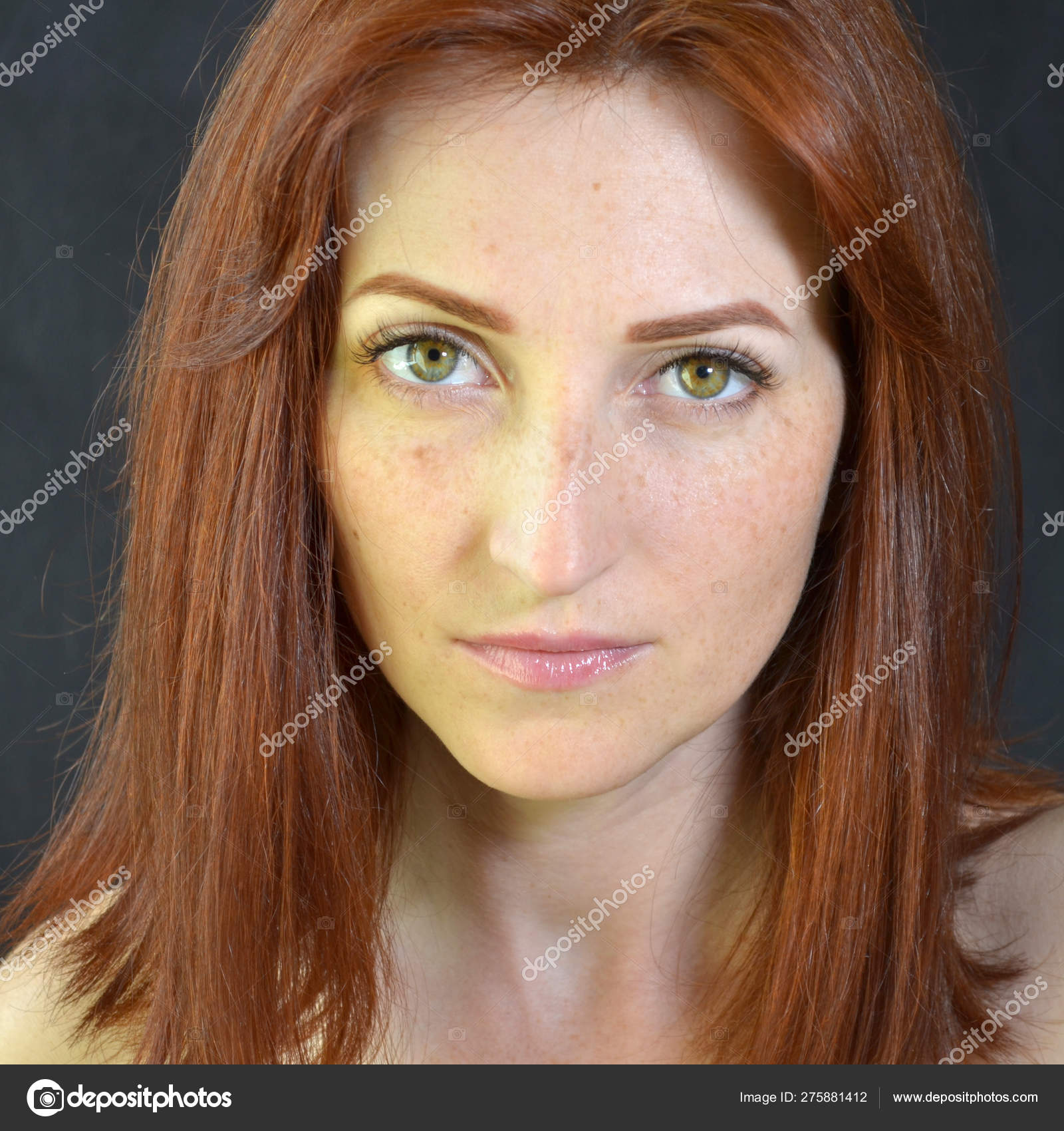 White Girl With Red Hair And Green Eyes With Eyelash Extensions On