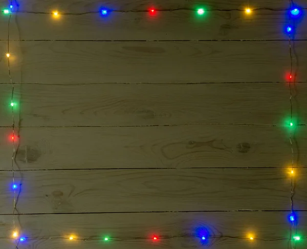 fairy lights on wooden background