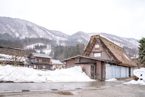 Villages of Shirakawago and Gokayama are one of Japan\'s UNESCO World Heritage Sites. Farm house in the village and mountain behind.