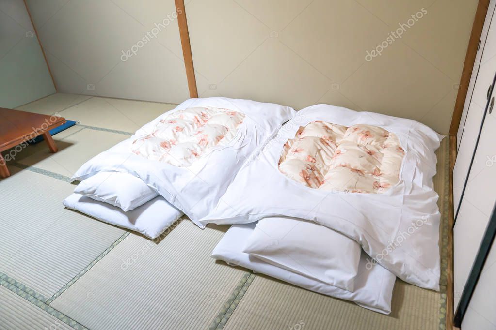 Futon; a Japanese quilted mattress rolled out on the floor (tatami) for use as a bed., Japan style.