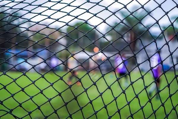 football goal net at the field with blur background.