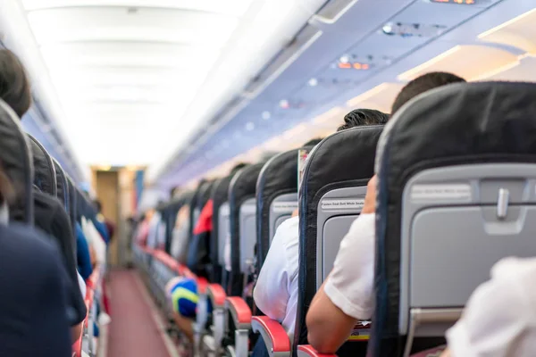 Asian Passenger Reading Magazine Menue Catalog While Waiting Plane Take — Stock Photo, Image