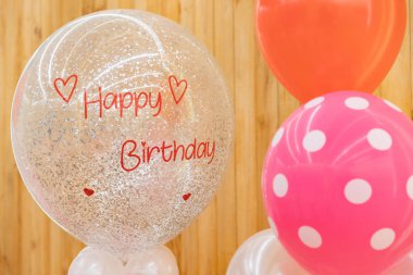 a happy birthday text on the balloon for gift in the birthday pa clipart