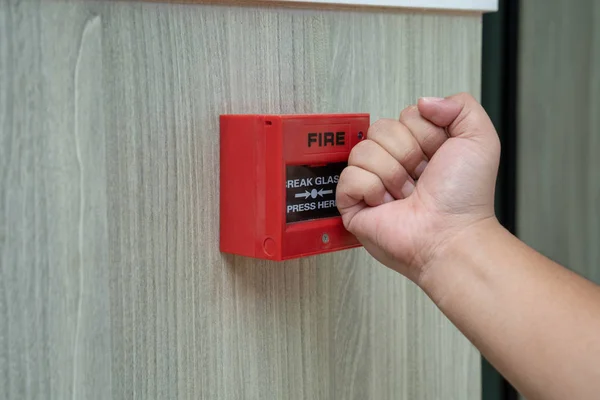 Fire alarm box with human hand action to crush the glass for eme