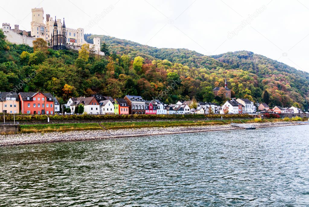 Rhine-Romantic-Route. A long line of colorful houses on the banks of the Rhine beneath the castle Stolzenfels in historic city Koblenz, Germany