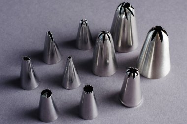 Confectionery nozzles for confectionery bag. Decoration of cake. clipart