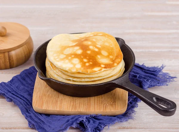 Pancakes with butter in a pan. — Stock Photo, Image