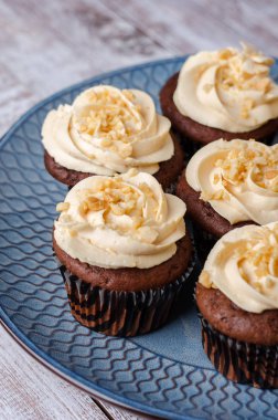 Chocolate cupcakes with caramel crea.