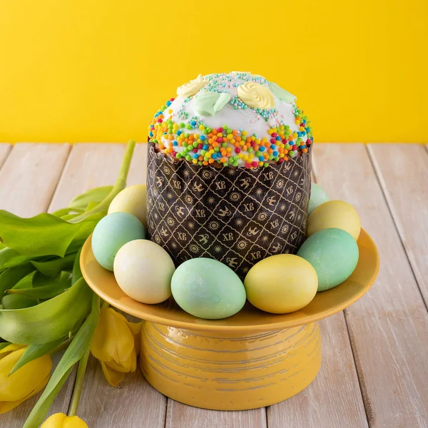 Easter cake on yellow background.