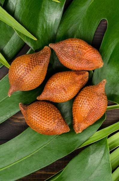 Snake fruit, rakum, sala on wood background