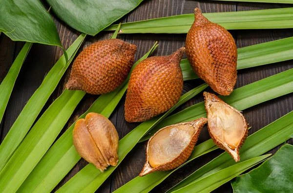 Snake fruit, rakum, sala on wood background