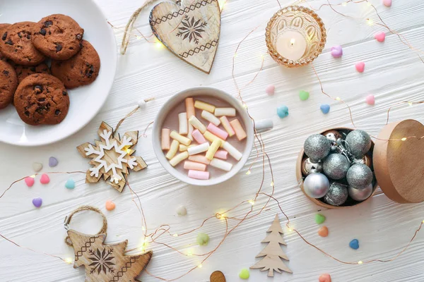 Christmas composition with cocoa, cookies and Christmas decorations on a white background. Flat lay, top view