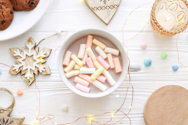 Christmas composition with cocoa, cookies and Christmas decorations on a white background. Flat lay, top view