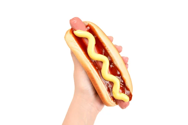 Hot dog en main de femme isolé sur fond blanc. Espace de copie. — Photo