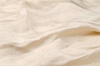 Yumuşak bej ipek kumaş arka plan. Kumaş dokusu. 