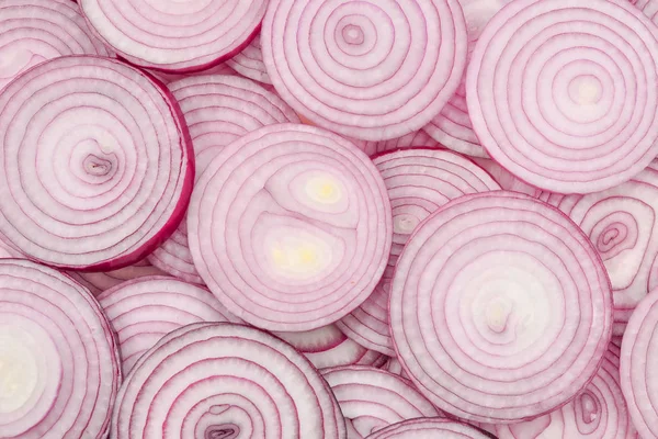 Onion slices as a background. Top view.