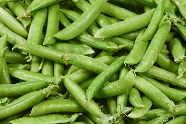 Fresh pea pods as background. Top view. — Stock Photo, Image