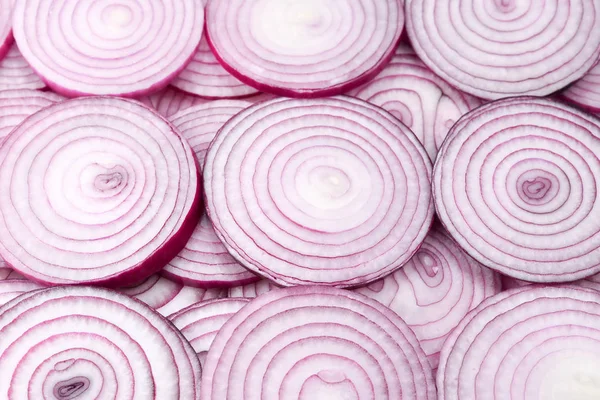 Onion slices as a background. Top view.