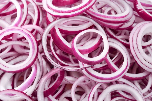 Onion rings as a background. Top view.