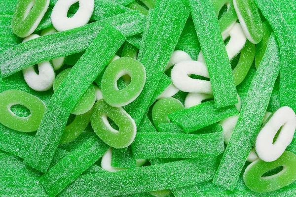 Válogatott zöld gumi cukorka háttér. Első látásra. Zselés édesség — Stock Fotó